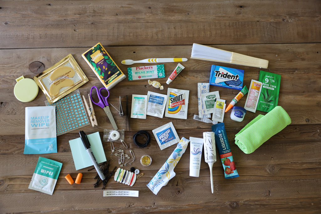 Collection of various items including snacks, cleaning supplies, and stationery on a wooden surface.