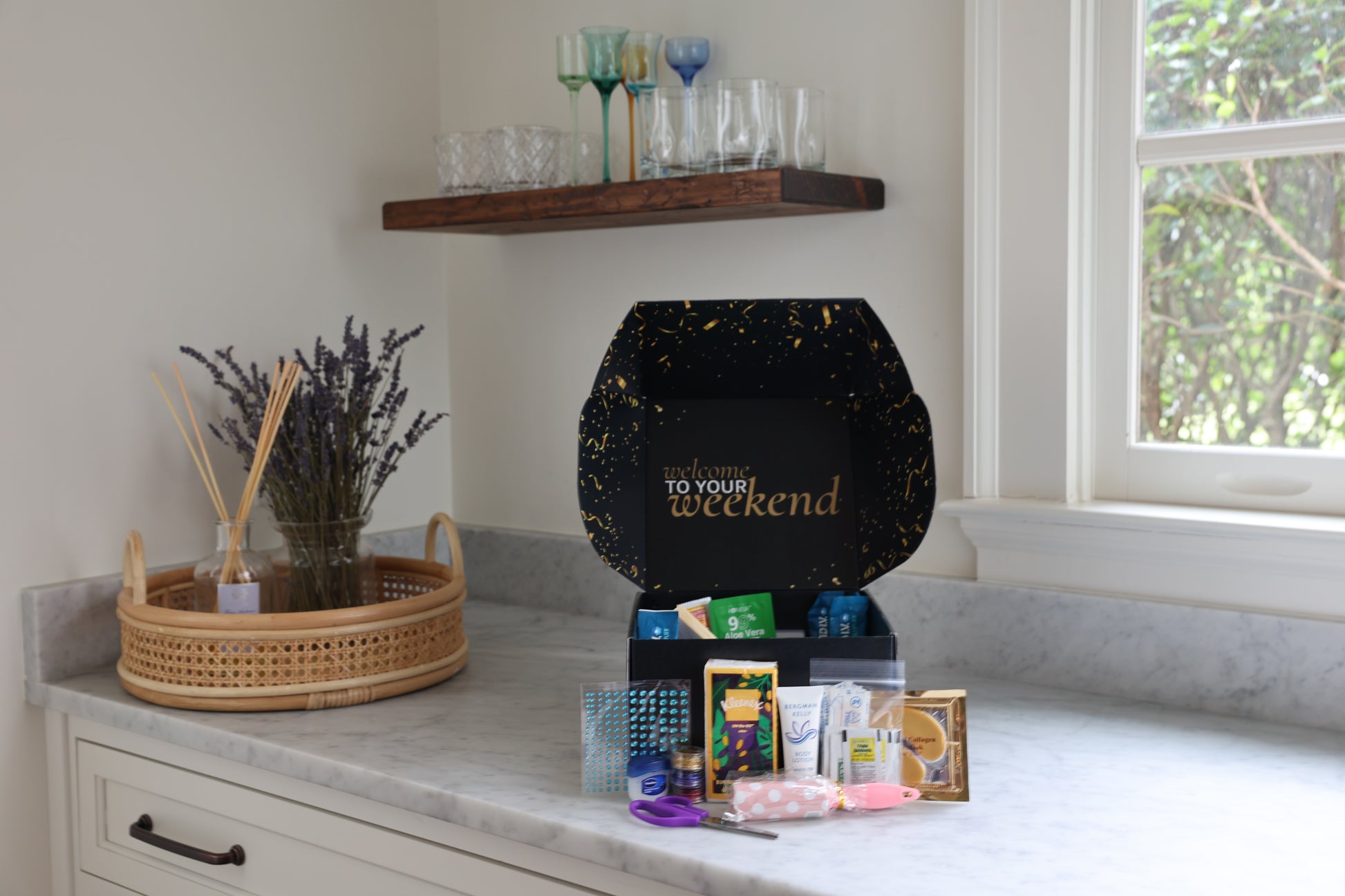 Product packaging on a counter with decorative items and a window in the background